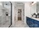 Modern bathroom with navy blue vanity and marble shower at 2387 Trundle Dr # Cwo0155, Gastonia, NC 28054