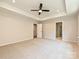 Neutral bedroom with a ceiling fan, carpeted floor, and two doors at 2387 Trundle Dr # Cwo0155, Gastonia, NC 28054