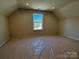 Upstairs bedroom with a vaulted ceiling and a large window at 2387 Trundle Dr # Cwo0155, Gastonia, NC 28054