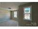 Bright bedroom with two windows and neutral walls at 2387 Trundle Dr # Cwo0155, Gastonia, NC 28054