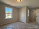 New construction bedroom with a large window, ceiling light, and an en-suite bathroom at 2387 Trundle Dr # Cwo0155, Gastonia, NC 28054