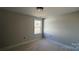 Unfinished bedroom with one window and neutral walls at 2387 Trundle Dr # Cwo0155, Gastonia, NC 28054