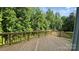 Spacious wooden deck overlooking lush greenery, perfect for outdoor entertaining and relaxation at 2387 Trundle Dr # Cwo0155, Gastonia, NC 28054