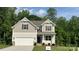 Charming two-story home featuring a two-car garage and craftsman-style architectural details at 2387 Trundle Dr # Cwo0155, Gastonia, NC 28054