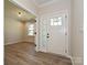 Bright foyer featuring a white front door with glass panels and a view into the living spaces at 2387 Trundle Dr # Cwo0155, Gastonia, NC 28054