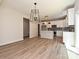 Open-concept living area featuring a kitchen, dining area, and seamless indoor-outdoor flow at 2387 Trundle Dr # Cwo0155, Gastonia, NC 28054