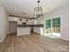 Modern kitchen featuring stainless appliances, tile backsplash, and sliding glass doors to the wooden deck at 2387 Trundle Dr # Cwo0155, Gastonia, NC 28054