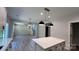 Eat-in kitchen features a central island with modern countertops, cabinets, and sleek fixtures at 2387 Trundle Dr # Cwo0155, Gastonia, NC 28054