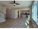 Bright living room with hardwood floors and large windows connecting to an open kitchen at 2387 Trundle Dr # Cwo0155, Gastonia, NC 28054