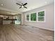 Living room featuring large windows, hardwood floors, and an open floor plan at 2387 Trundle Dr # Cwo0155, Gastonia, NC 28054