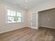 Home office with natural light, hardwood floors, and a French door entryway at 2387 Trundle Dr # Cwo0155, Gastonia, NC 28054