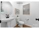 Modern powder room with pedestal sink and wood flooring at 2387 Trundle Dr # Cwo0155, Gastonia, NC 28054