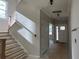 Wooden staircase with white risers and wooden railing leads to the second floor at 2387 Trundle Dr # Cwo0155, Gastonia, NC 28054