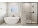 Bathroom with walk-in shower and marble tile at 3118 Whispering Creek Dr # 188, Indian Trail, NC 28079