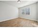 Light filled bedroom with hardwood floors and window at 3118 Whispering Creek Dr # 188, Indian Trail, NC 28079