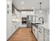 Modern kitchen with stainless steel appliances and farmhouse sink at 3118 Whispering Creek Dr, Indian Trail, NC 28079