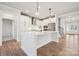 Open concept kitchen with island and stainless steel appliances at 3118 Whispering Creek Dr # 188, Indian Trail, NC 28079