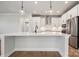 Modern kitchen with white cabinets and a large island at 3118 Whispering Creek Dr # 188, Indian Trail, NC 28079