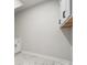 White cabinets and marble floors in the laundry room at 3118 Whispering Creek Dr, Indian Trail, NC 28079