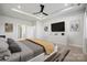 Spacious bedroom features a ceiling fan, recessed lighting, and a wall-mounted television above a white dresser at 3118 Whispering Creek Dr, Indian Trail, NC 28079