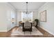 Elegant dining room featuring modern decor, natural light, and a stylish rug, perfect for entertaining at 3118 Whispering Creek Dr, Indian Trail, NC 28079