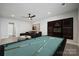 Basement game room with a pool table, lounge seating, and stylish decorations at 3118 Whispering Creek Dr, Indian Trail, NC 28079