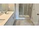 Bathroom with a double sink vanity and glass enclosed shower at 115 Ciara Pl # B, Mooresville, NC 28117