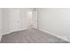 Simple bedroom with grey carpeting and an open door at 115 Ciara Pl # C, Mooresville, NC 28117