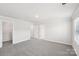 Bedroom with gray carpet, a closet, and neutral walls at 115 Ciara Pl # D, Mooresville, NC 28117