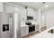 Modern kitchen featuring stainless steel appliances and gray cabinets at 115 Ciara Pl # D, Mooresville, NC 28117