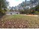 Spacious backyard with deck and wooded area at 136 Creek Branch Dr, Mooresville, NC 28115