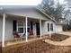 Ranch home with covered porch and attached garage at 136 Creek Branch Dr, Mooresville, NC 28115