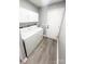 Bright laundry room, featuring washer, dryer, and ample storage at 136 Creek Branch Dr, Mooresville, NC 28115