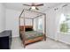 Bright bedroom with a canopy bed, dresser, and plenty of natural light at 2608 Grantham Place Dr, Fort Mill, SC 29715