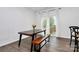 Bright dining area with wooden table and bench, perfect for Gathering meals at 2608 Grantham Place Dr, Fort Mill, SC 29715