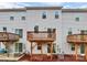 Rear view of townhouses with wooden decks at 2608 Grantham Place Dr, Fort Mill, SC 29715