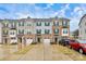 Front view of three-story townhouses at 2608 Grantham Place Dr, Fort Mill, SC 29715