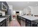 Granite countertops and stainless steel appliances in this open kitchen at 2608 Grantham Place Dr, Fort Mill, SC 29715