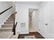 Modern staircase with dark wood railing and neutral carpet at 2608 Grantham Place Dr, Fort Mill, SC 29715