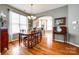 Formal dining room with hardwood floors and view into the kitchen at 786 Petersburg Dr, Fort Mill, SC 29708