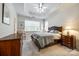 Main bedroom with tray ceiling, carpeted floor, and ample natural light at 786 Petersburg Dr, Fort Mill, SC 29708