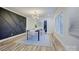 Elegant dining room featuring a statement wall and hardwood floors at 1033 Dooley Dr, Charlotte, NC 28227