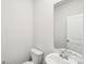 Small bathroom with white sink, toilet, and vanity at 115 Ciara Pl # A, Mooresville, NC 28117