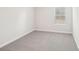Simple bedroom with grey carpet and window at 115 Ciara Pl # A, Mooresville, NC 28117
