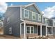 Two-story house with gray siding, white trim, and brick accents at 115 Ciara Pl # A, Mooresville, NC 28117