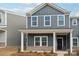 Gray siding, white trim, and a covered porch at 115 Ciara Pl # A, Mooresville, NC 28117