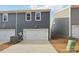 Attached garage with white door and AC unit at 115 Ciara Pl # A, Mooresville, NC 28117
