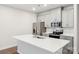 Modern kitchen with gray cabinets, white countertops, and stainless steel appliances at 115 Ciara Pl # A, Mooresville, NC 28117