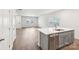Open concept kitchen and living area with hardwood floors at 115 Ciara Pl # A, Mooresville, NC 28117