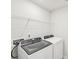 Laundry room with washer, dryer, and overhead shelving at 115 Ciara Pl # A, Mooresville, NC 28117